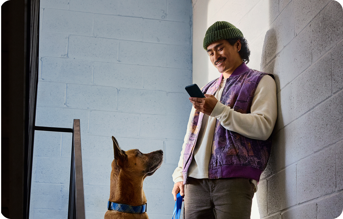 image of man standing in the hallway with a dog