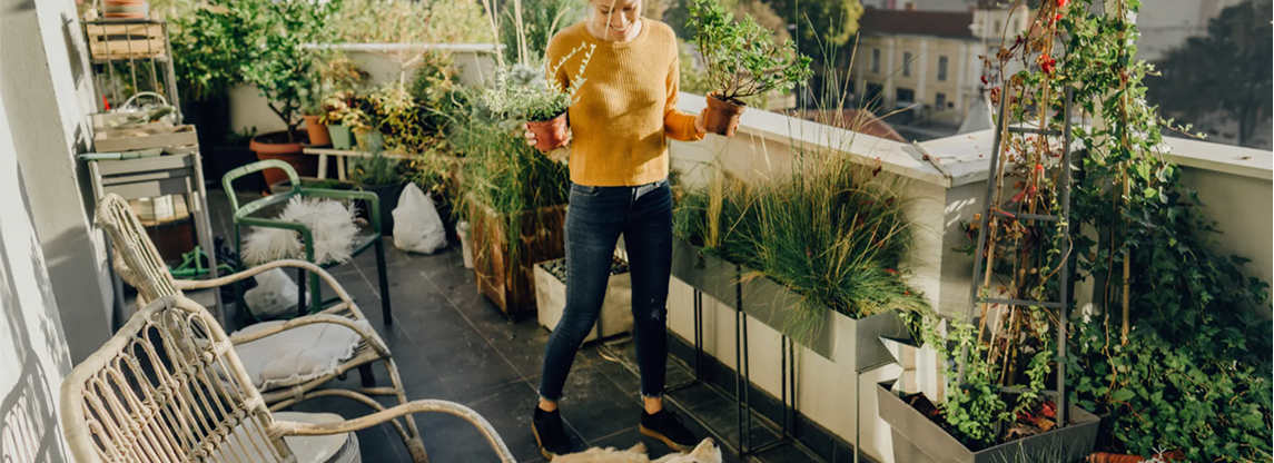 image of woman standing outside with plants