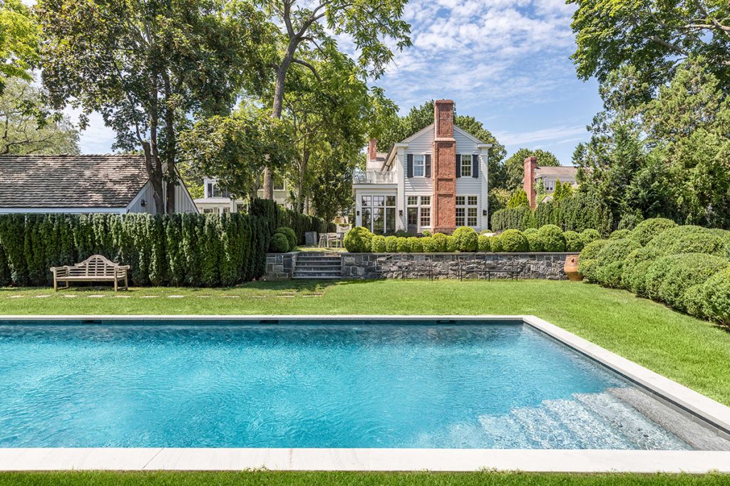 image of swimming pool and old house in sag harbor