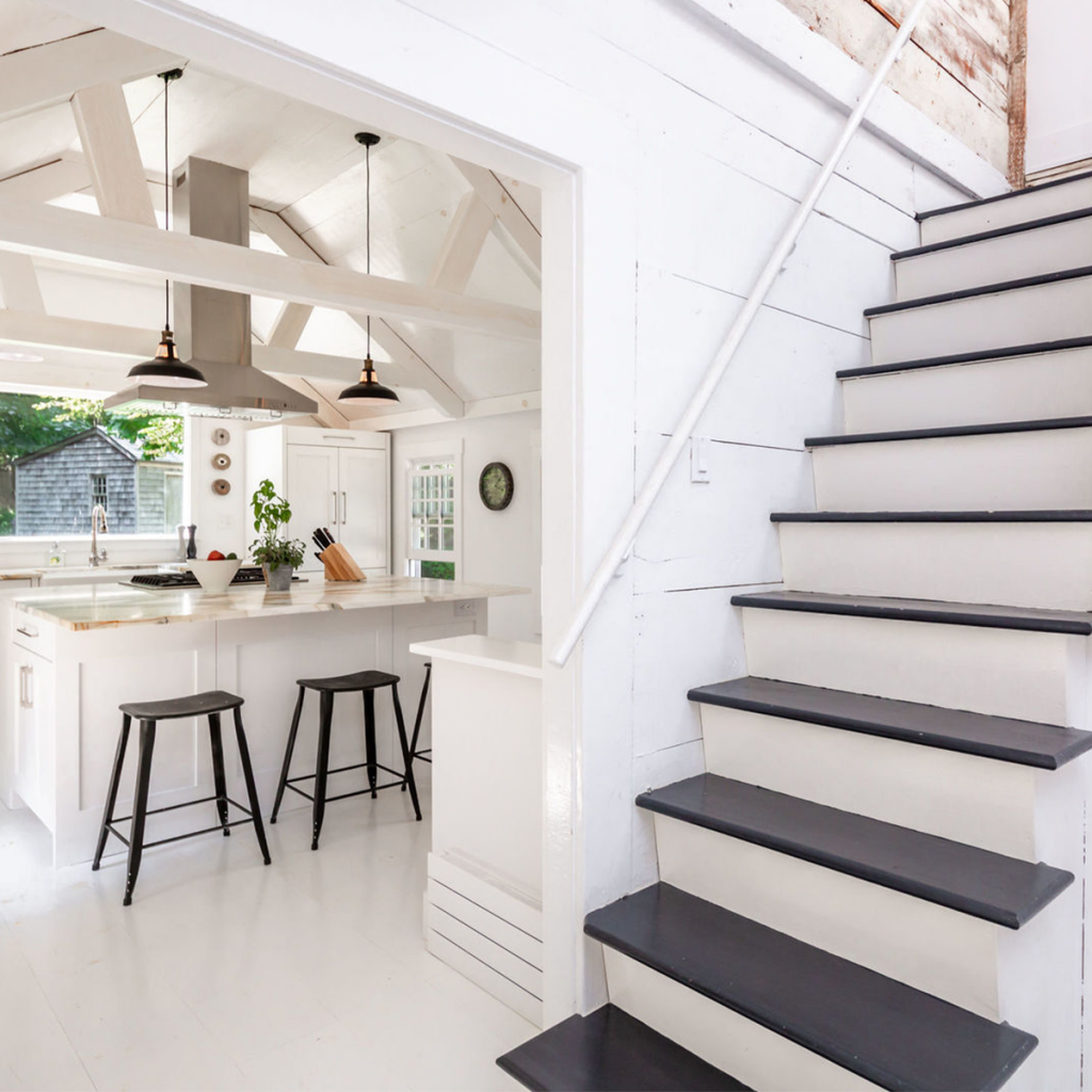 A photo of the kitchen and stairs in 25 Three Mile Harbor Rd, East Hampton