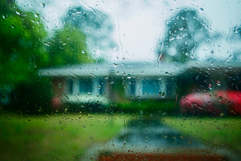 House through rainy window