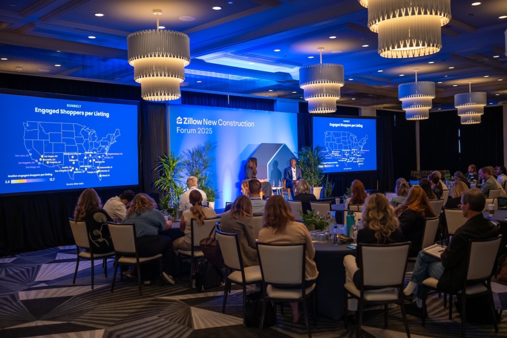 wide shot of econ session at new construction forum
