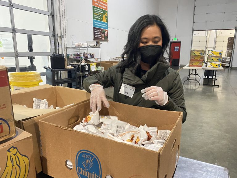 Zillow employee volunteering at a food bank