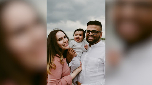 photo of man, woman and baby