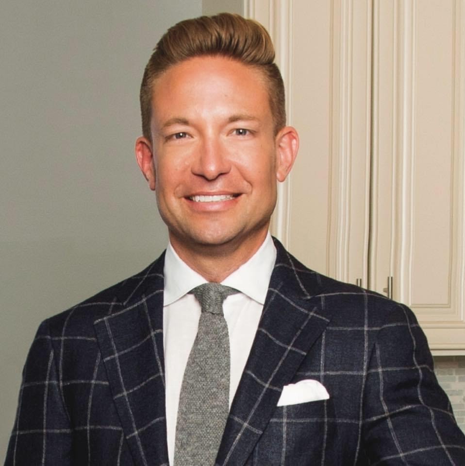 Portrait of Nick Libert in a suite and tie