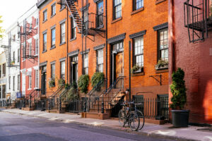 row of NYC townhouses for condo vs. townhouse