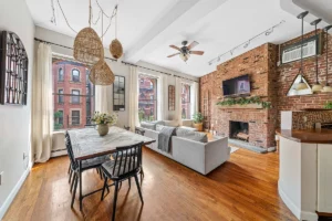 living and dining room with exposed brick in Upper West Side 2-bedroom