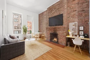 living room in Lincoln Square apartment - NYC homes with fireplaces