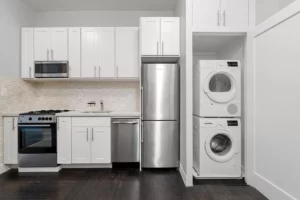 kitchen with washer dryer in Yorkville apartments