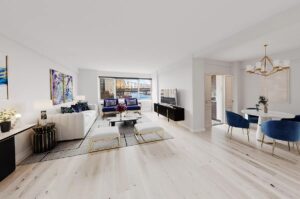 living room with East River views - homes in Midtown East