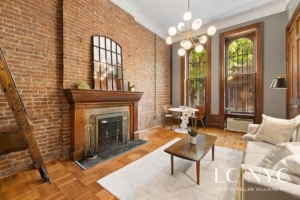 living room with fireplace in Upper West Side 1-bedroom