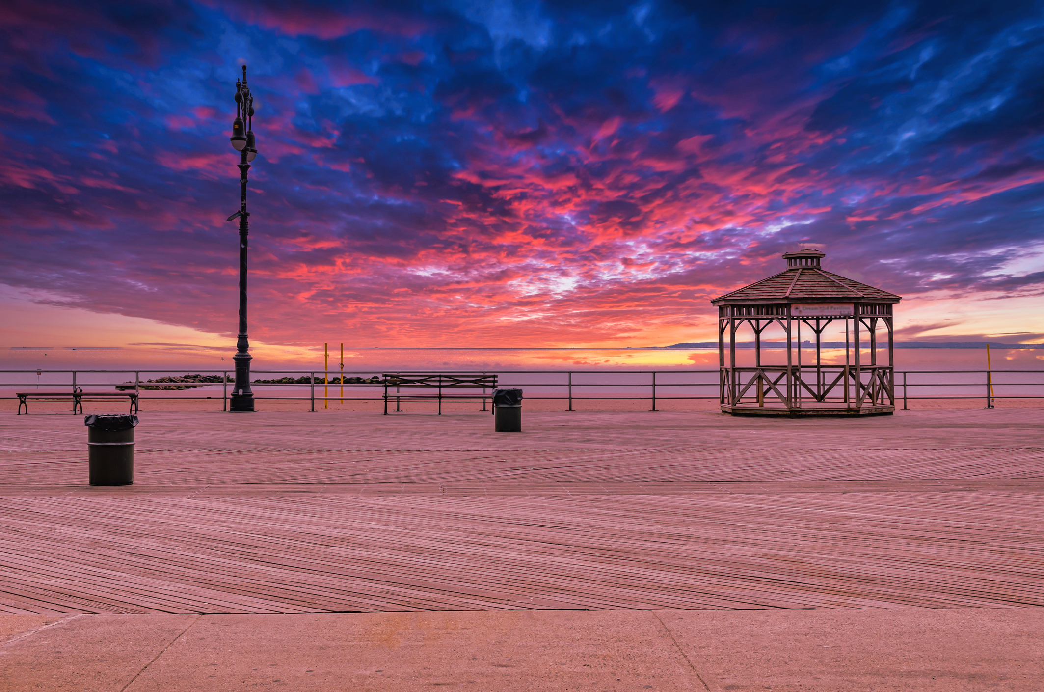 Coney Island Boardwalk with pavilion during sunset with beautiful sky