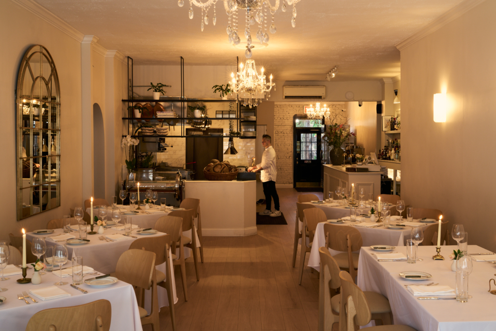 Chef Yvan Lemoine stands in the dining room at his Forest Hills restaurant Tourmaline