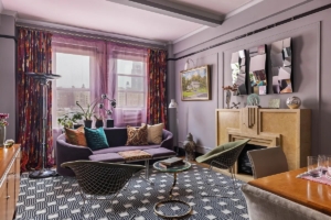 purple-walled living room in colorful Upper West Side 1-bedroom