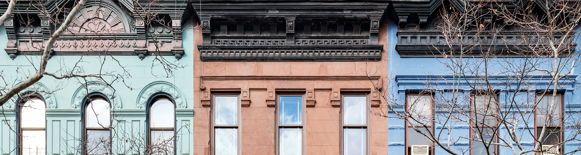 nyc real estate rebound - header - colorful townhouses