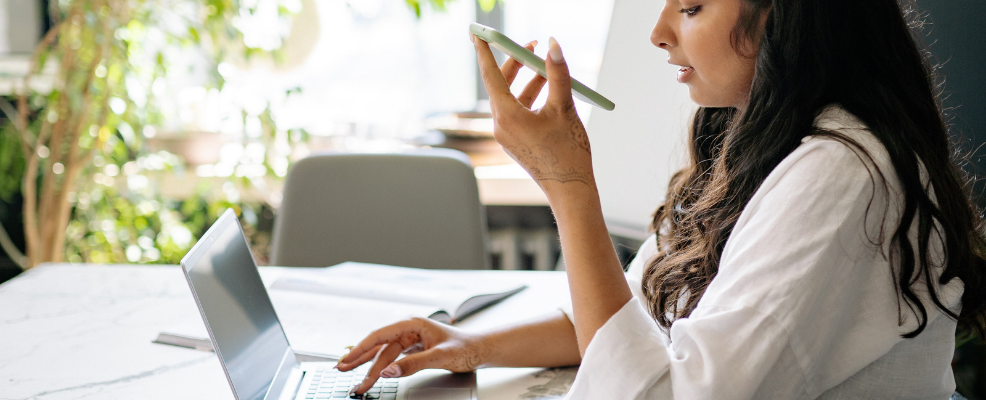 Real estate agent speaking on phone with client