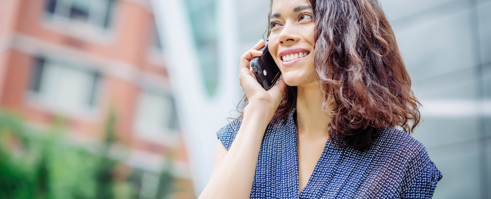 Real estate agent speaking on the phone with a client