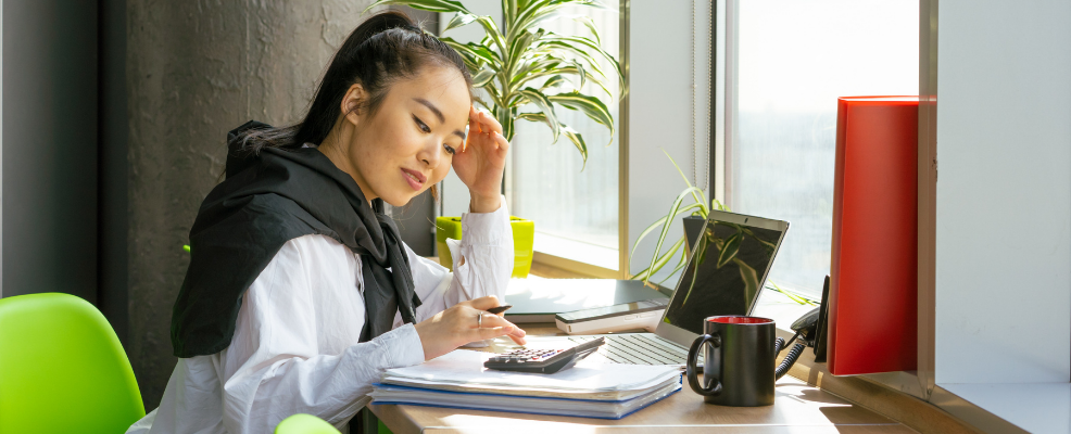 Woman using calculator