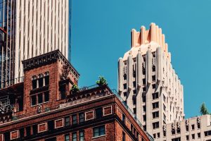 Manhattan buildings against blue sky