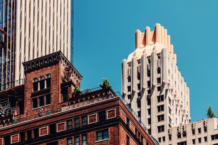 Manhattan buildings against blue sky