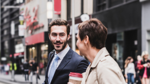 Two businesspeople walking and having a conversation