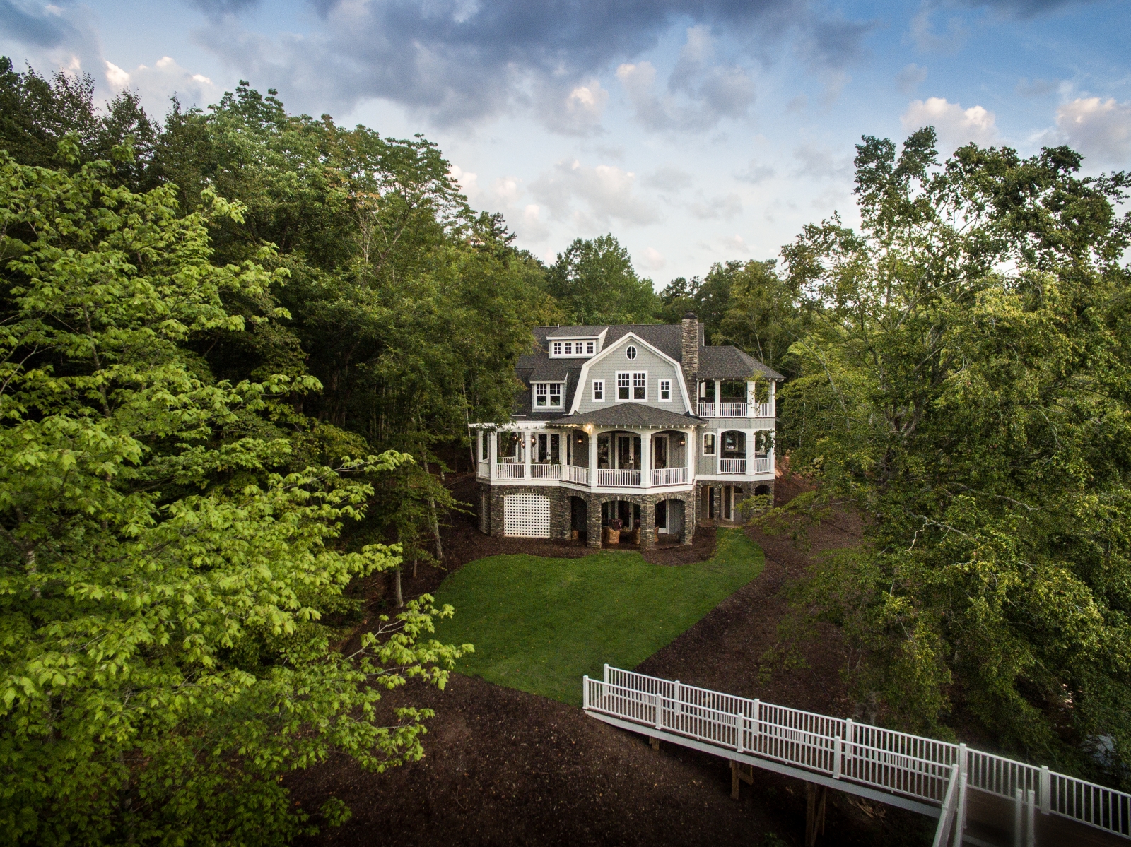 Using real estate drone photography to photograph a house and it's surrounding landscape.