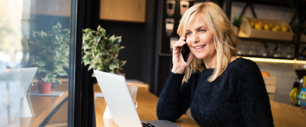 An agent following a real estate lead conversion plan while on the phone with a client.