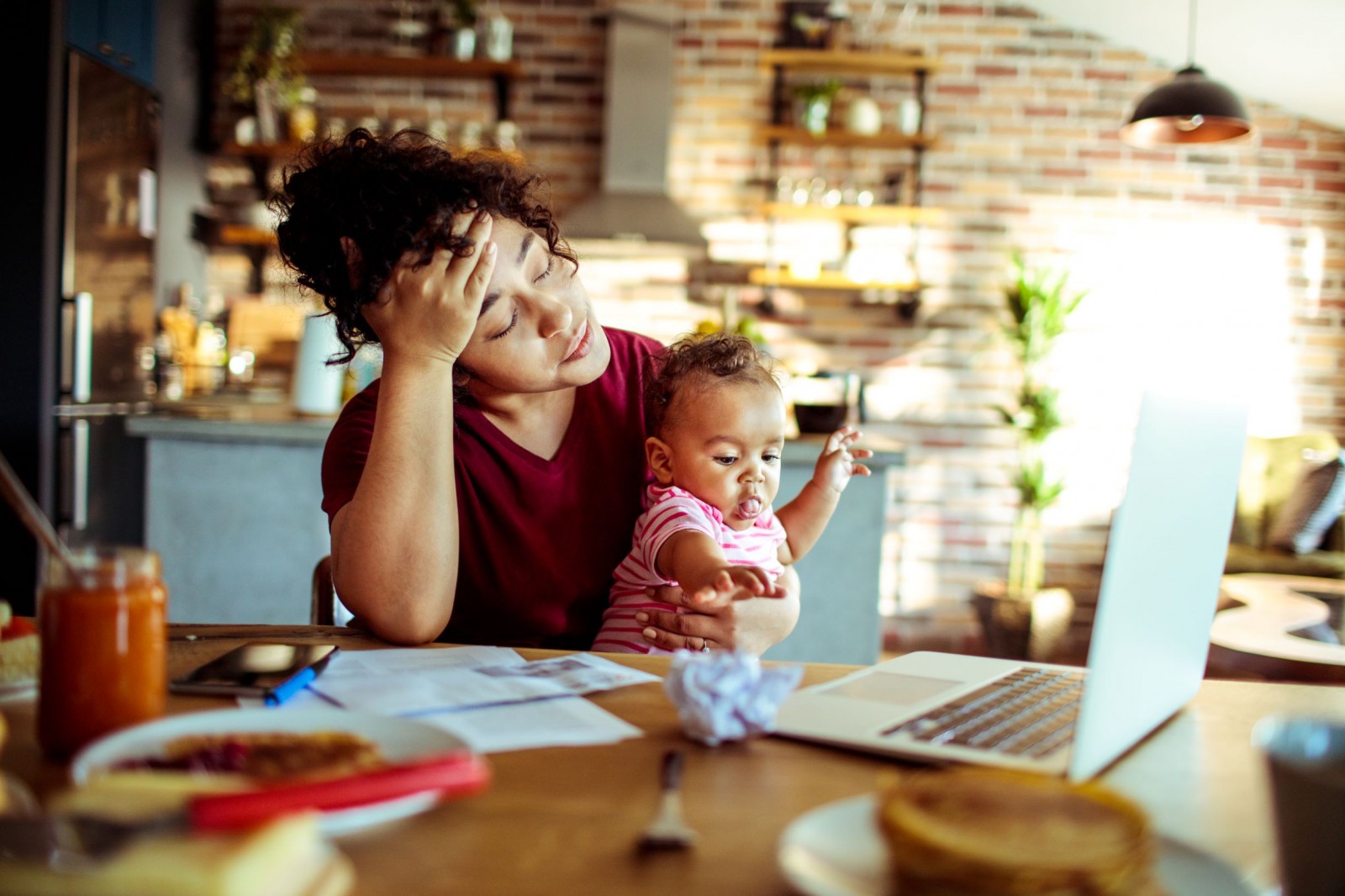 Stressed mom with child and bills