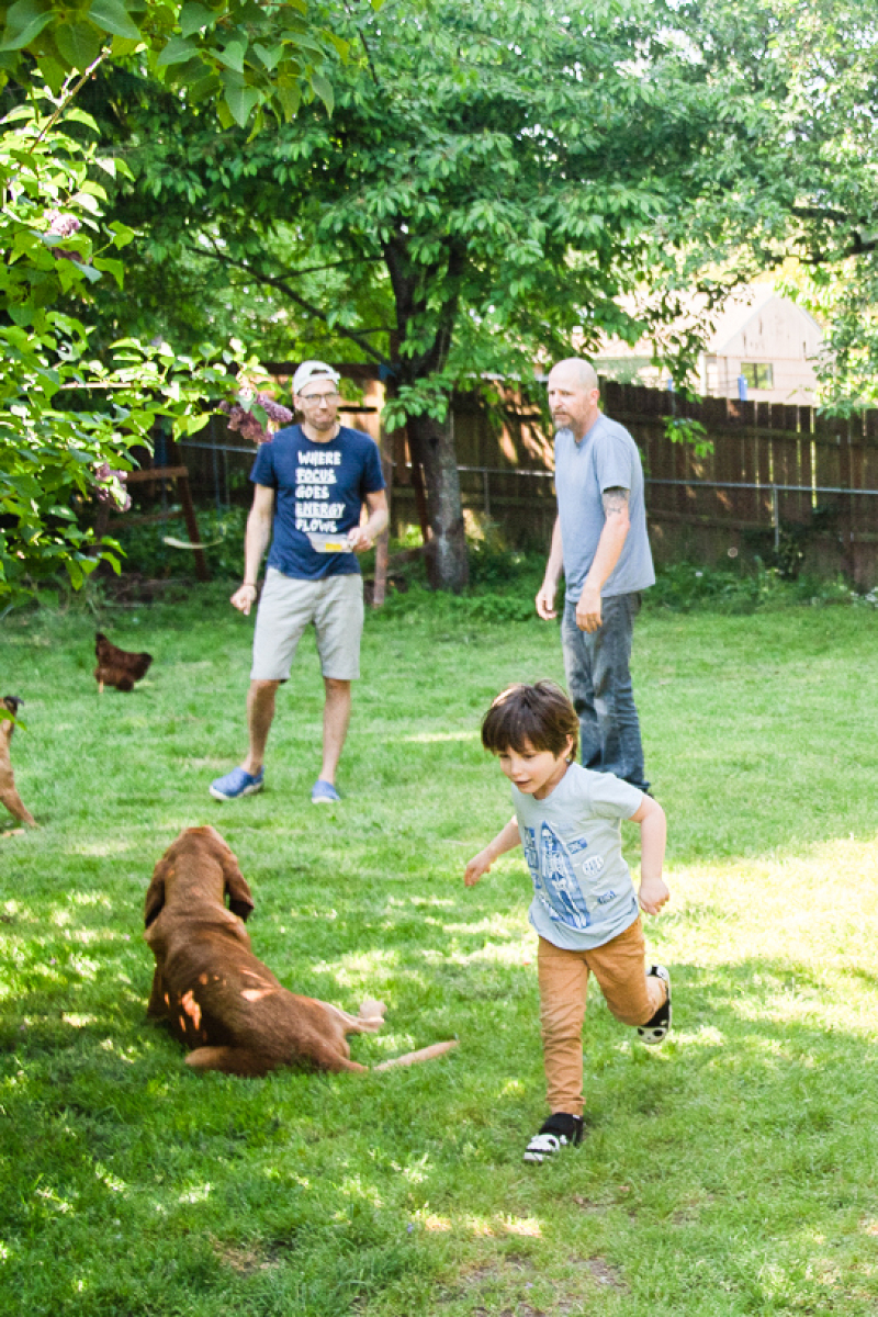 Renting out a room can lead to financial comfort and community for homeowners. Image of Seattle area residents and dogs in their yard.