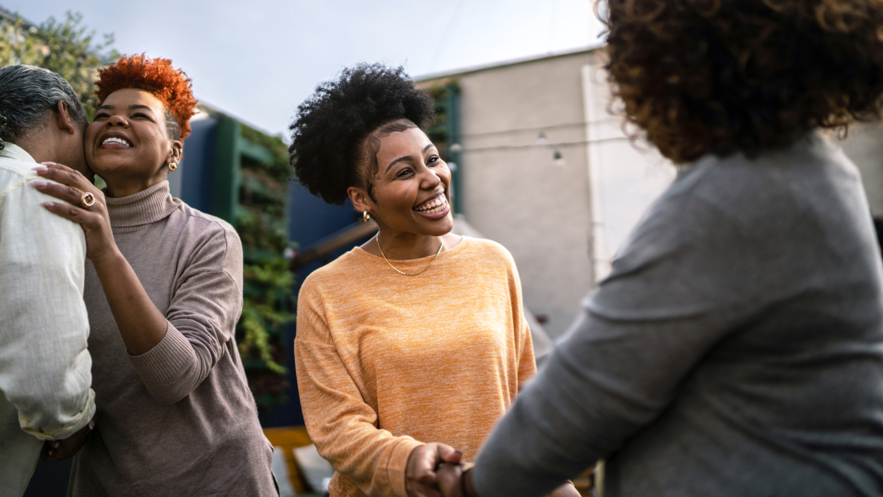 A woman asking a realtor questions when buying a house.
