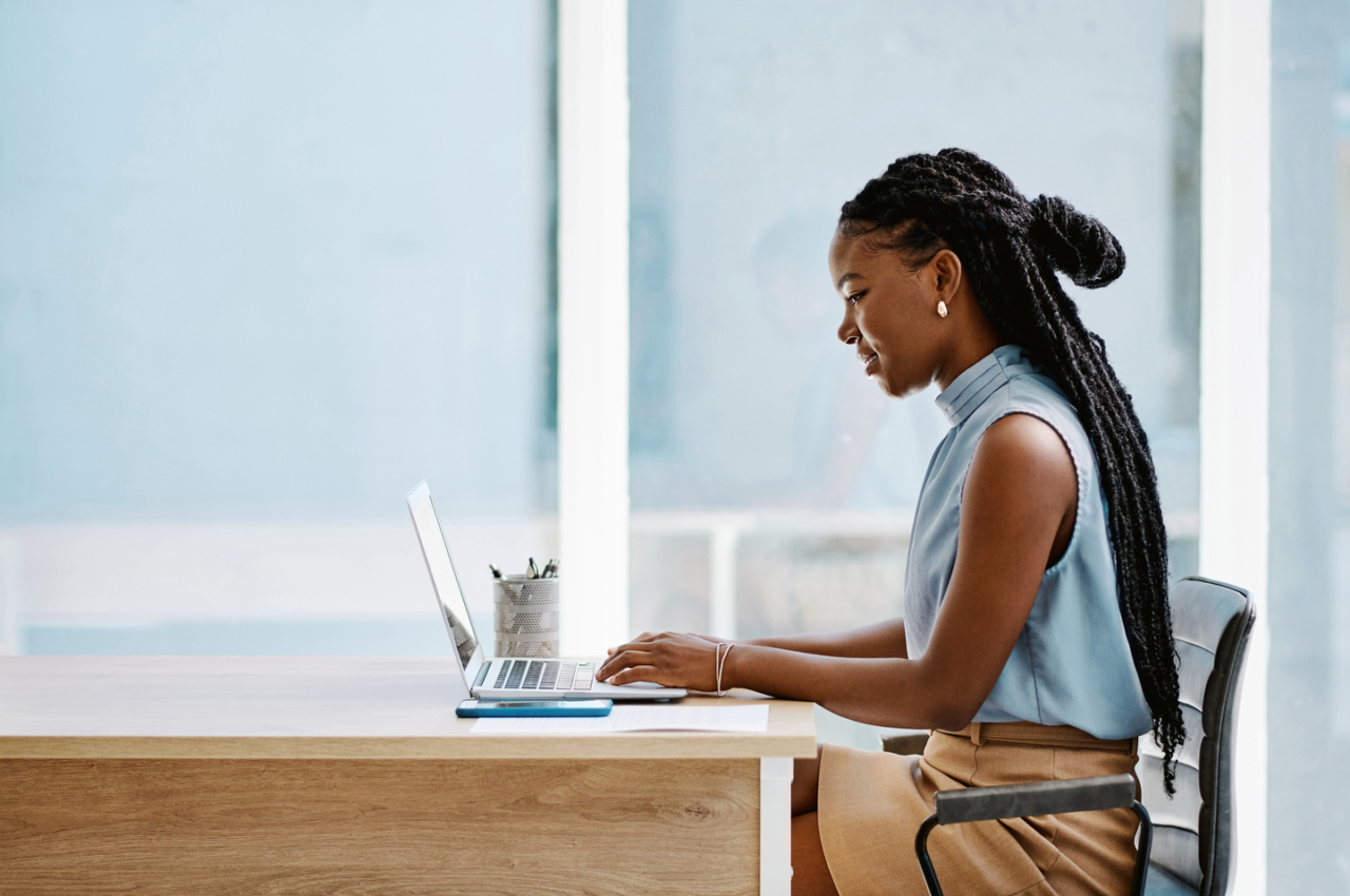A woman getting pre-qualified for a mortgage on her laptop.