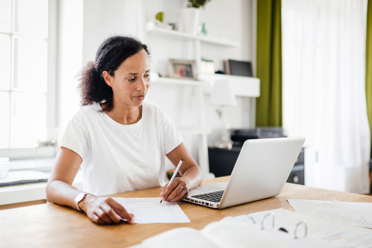 A woman considering what paperwork she needs to sell her house.