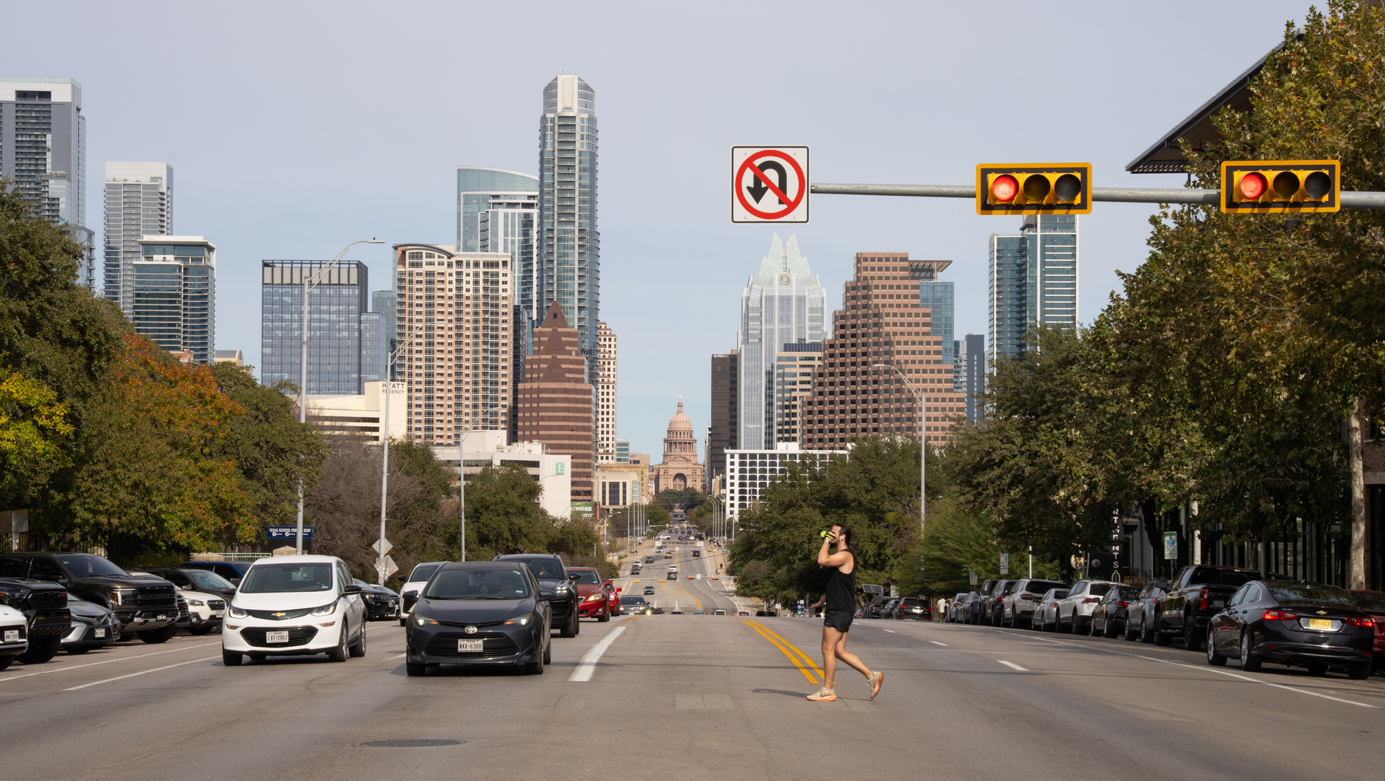 A street view of Downtown Austin, with high-rises in the background.