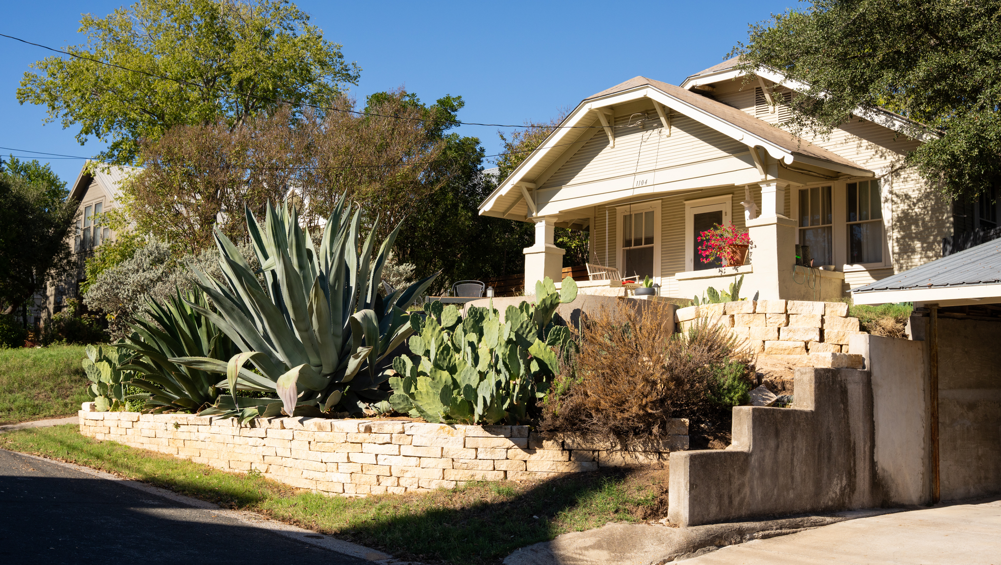 A street view of a bungalow-style home in Austin.
