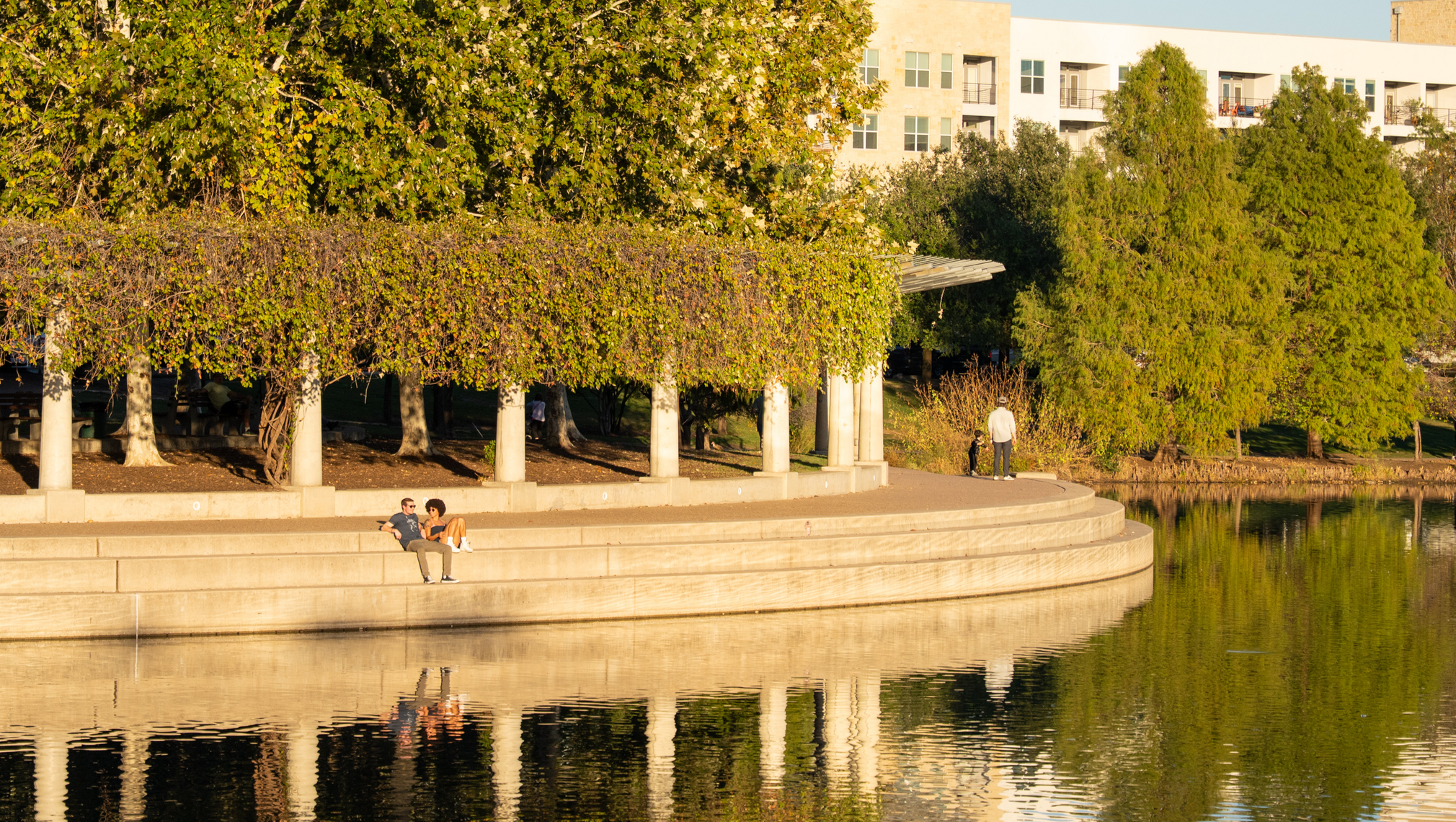 Overlooking the curved, concrete benches beside Mueller Lake in Austin.