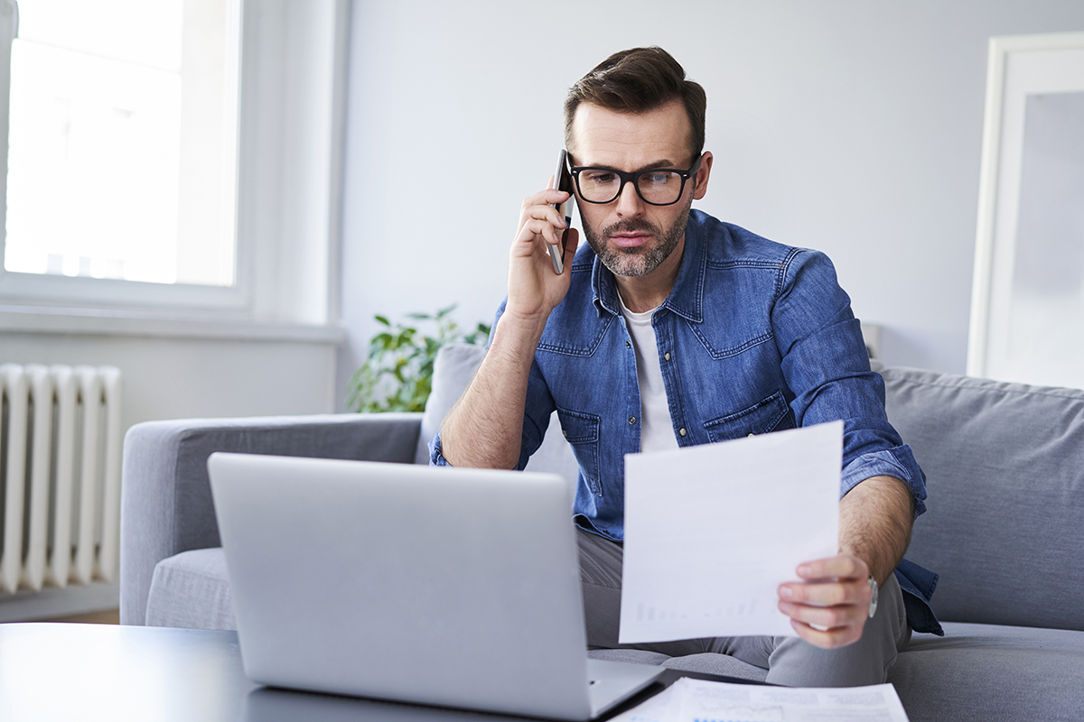 Home seller looking at a bad inspection report