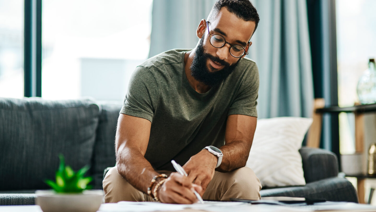 A man completing a mortgage application from home.