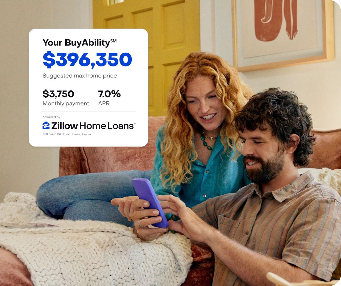 image of couple on couch with smartphone