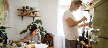 Happy couple relaxing together in their home