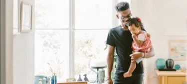 Father and child sharing a happy moment at home