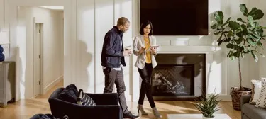 Agent showing home features to prospective buyers during tour