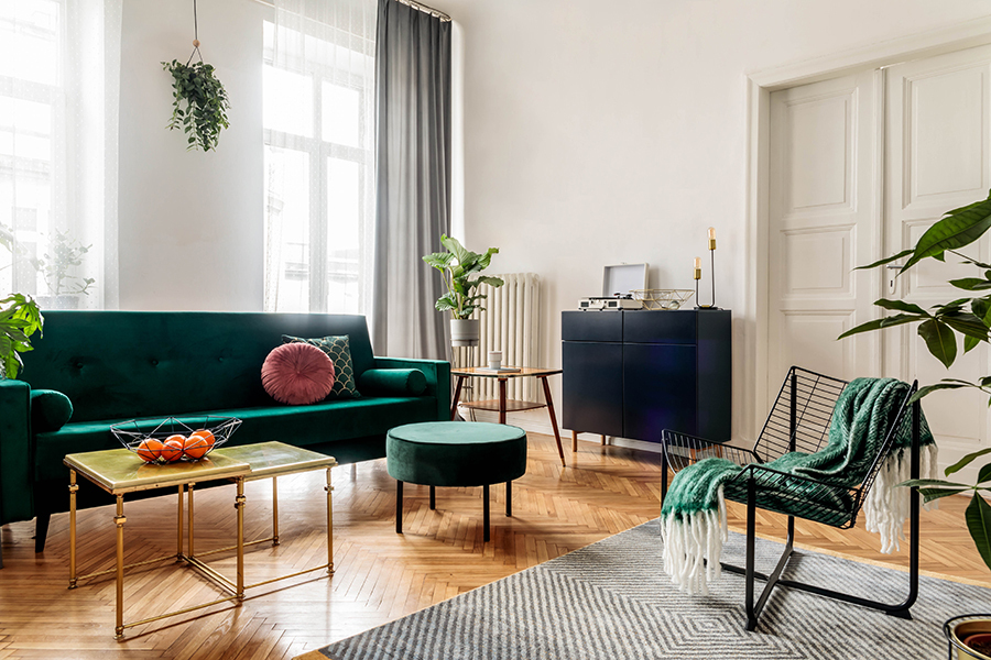 Modern living room with white walls and green furnishings