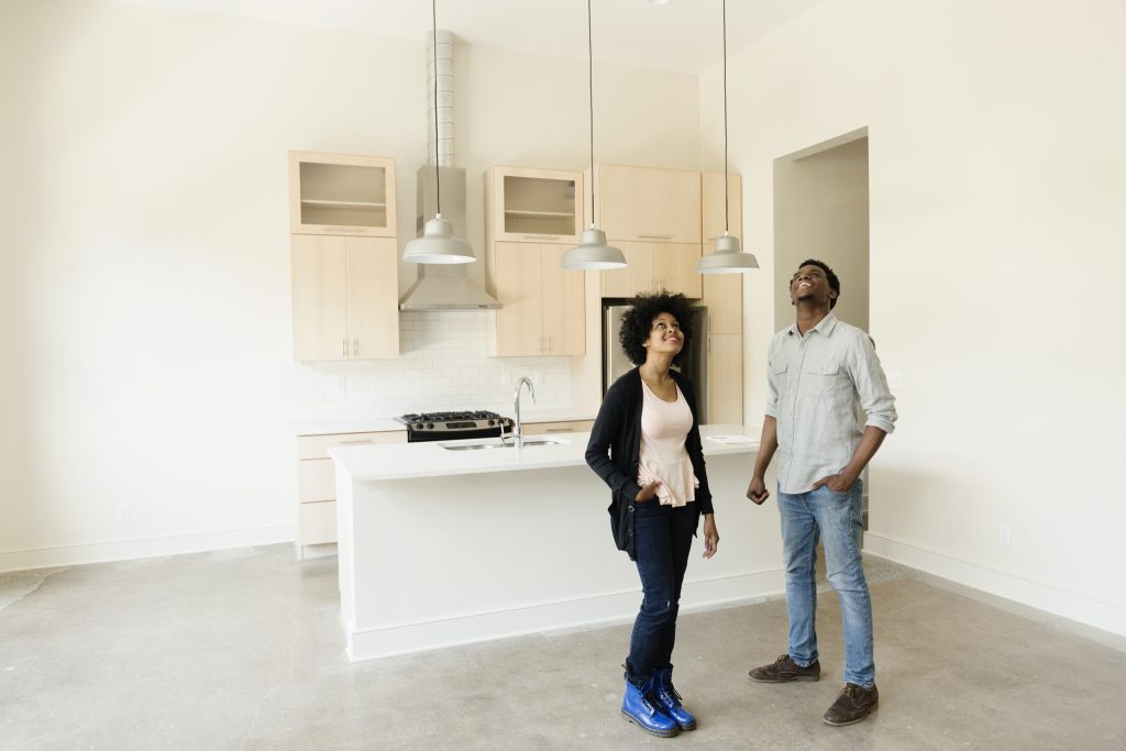 A landlord renting out a condo to a potential tenant.