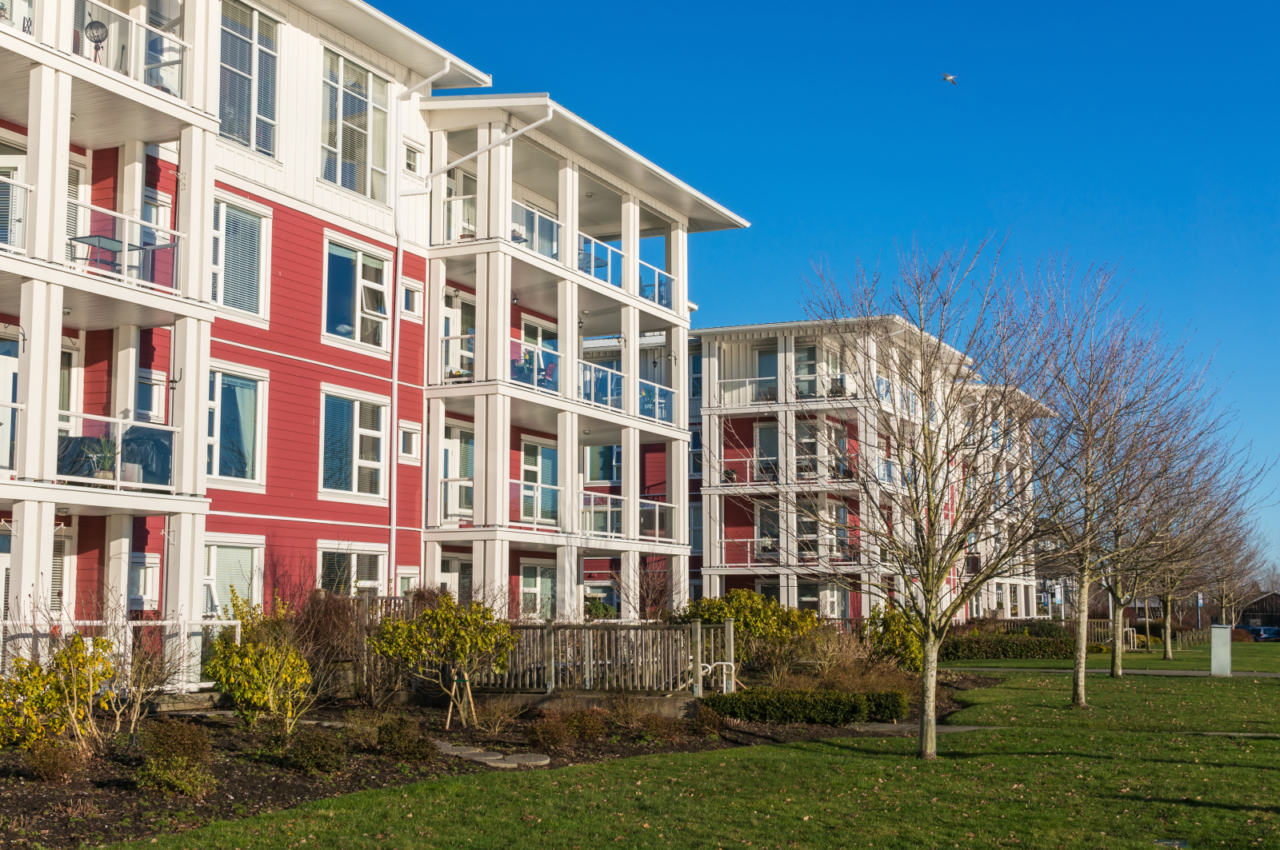 4-story apartment building with balconies