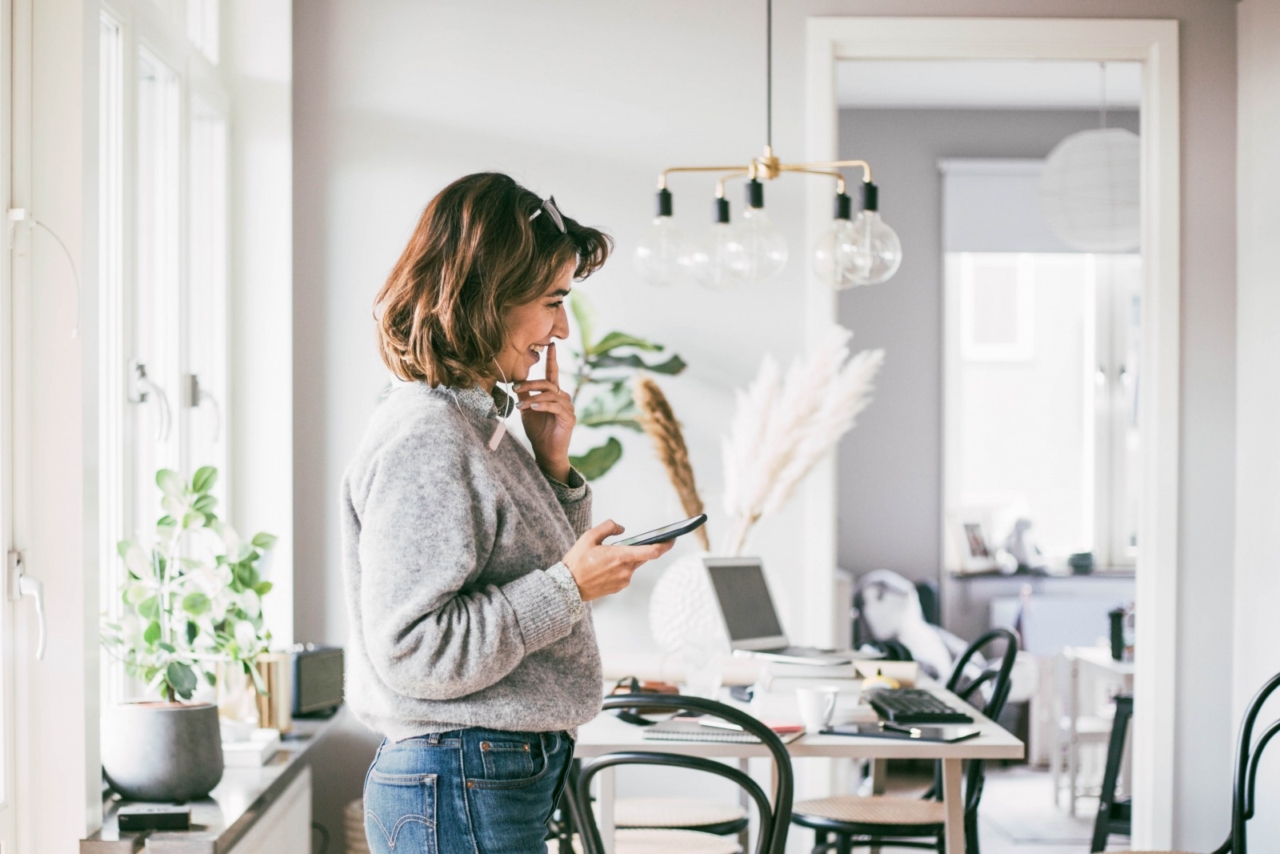 Agent on the phone in her living room