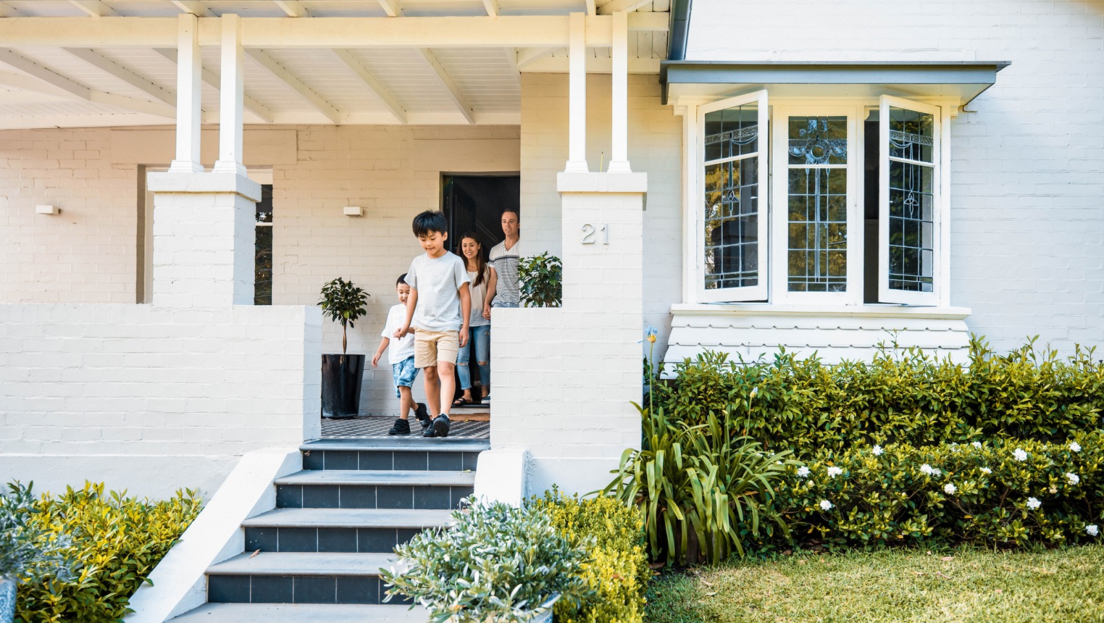 Family on a porch of a home