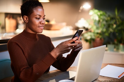 A real estate agent viewing updates to Zillow Premier Agent.
