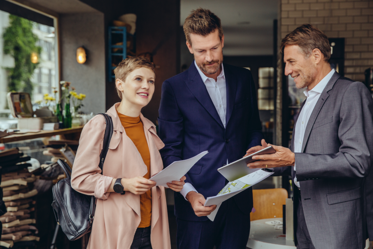 Home buyers consult with an agent.