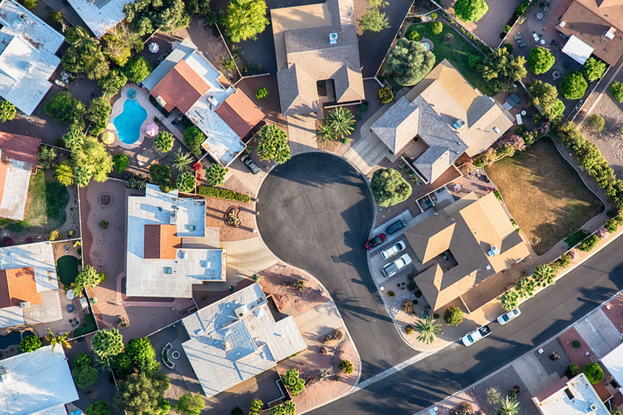 An aerial shot of a neighborhood using real estate drones.