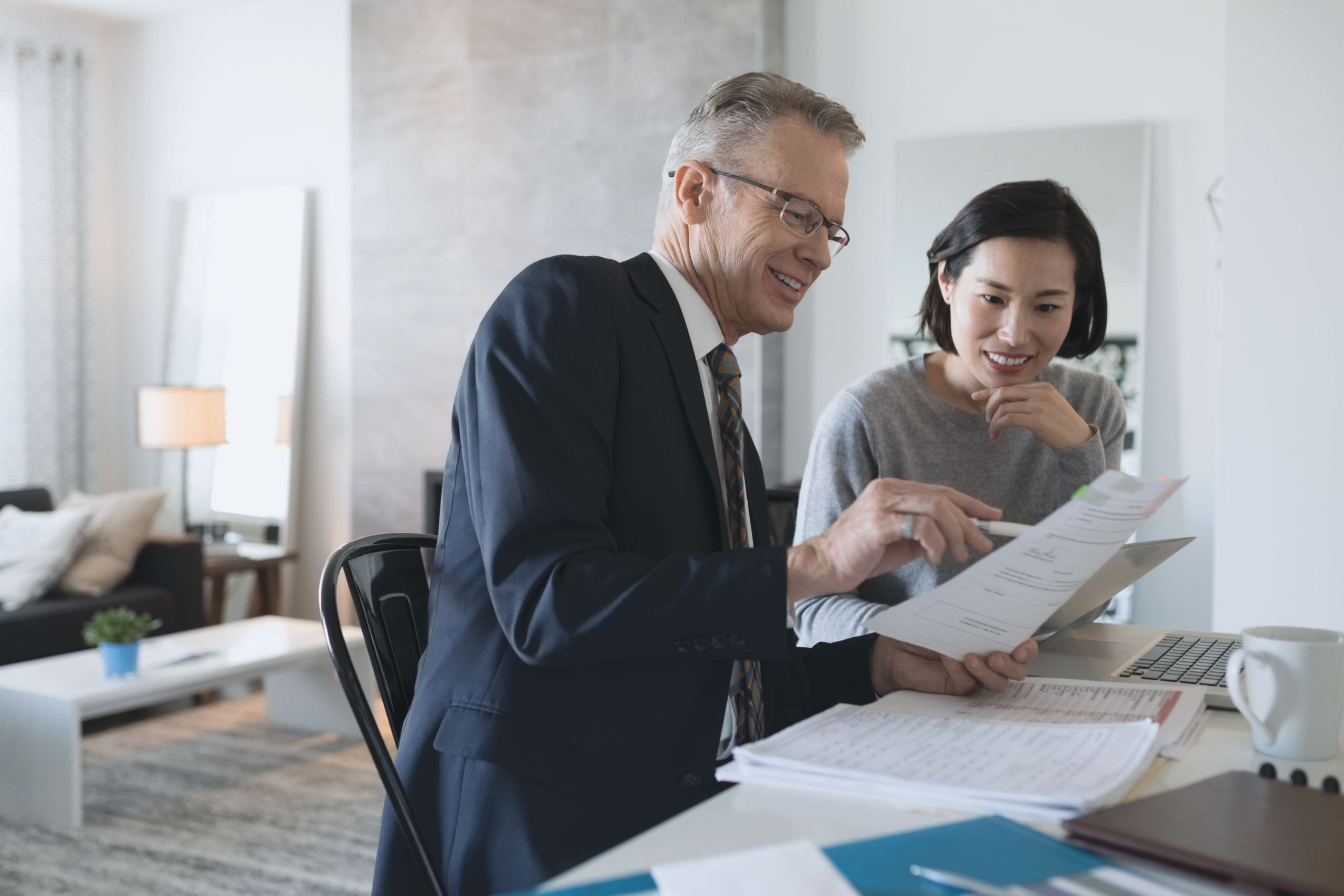 Man and woman reviewing financial documents